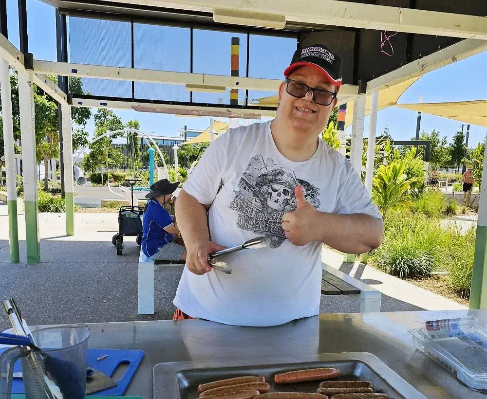 Compass Caboolture - trainee cooking a bbq
